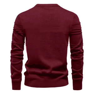Rear view of burgundy knit sweater showing ribbed crewneck and cuffs on white background