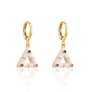 Golden triangle earrings with white enamel and colorful gemstones on white background
