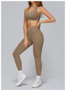 Close-up of brown cross-back sports bra and high-waist leggings with soft texture