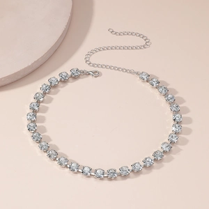 Detail of silver choker necklace with shimmering diamonds and lobster clasp closure