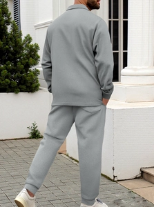 Rear view of men's dark grey waffle knit leisure set showing slim fit cut and texture