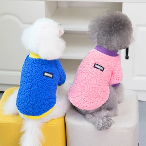 Soft fleece dog sweaters in blue and pink for small pets shown in home setting