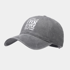 Detail view of washed cotton fabric and slogan print on a vintage baseball cap
