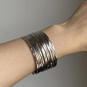 Minimalist silver multi-layer metal cuff bracelet with hammered texture finish for women