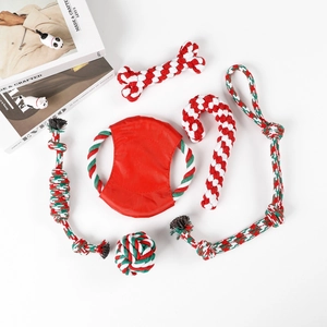 Macro shot of 6-piece Christmas cotton rope dog chew toys set in red, white and green