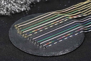 Macro shot of 2MM adjustable tennis bracelets with colorful zircons in multiple finishes