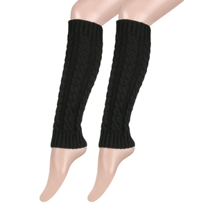Detail showing the thick cable knit texture of black slouchy leg warmers for women