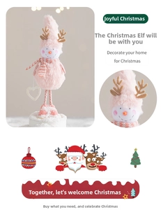 Close-up of plush snowman ornament with deer antlers and heart-shaped wooden charm