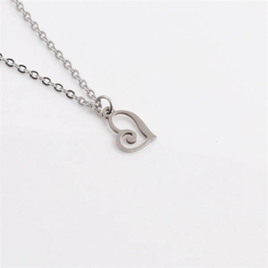 Minimalist silver titanium steel necklace with a unique swirl pattern heart pendant