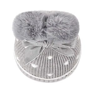 Grey knit baby hat with dual faux fur pom-poms, velvet bow, and white polka dot patterns