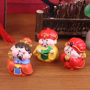 Three cute cartoon resin God of Wealth figurines with traditional Chinese decor
