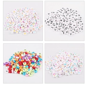 Macro detail of 4x7mm acrylic alphabet and number beads for DIY jewelry making