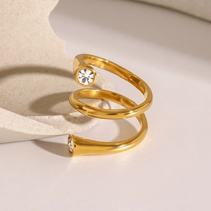 Detailed view of triple-layer spiral gold-plated ring featuring two brilliant zircons