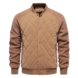 Detailed close-up of brown quilted jacket showing diamond pattern and metal buttons