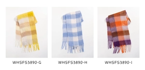 Detailed macro view of three plaid scarves with colorful patterns and fringed tassel edges