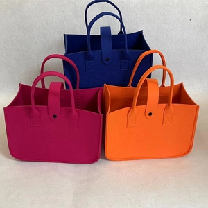 Felt tote bags in blue, rose, and orange colors with handle and snap button closure