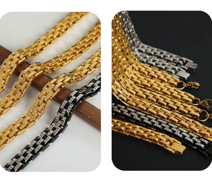 Close-up of gold and silver steel curb bracelets with Roman numeral engraved details