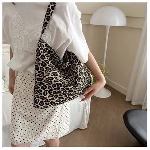 Macro shot of large leopard print canvas tote bag showing texture and spacious design