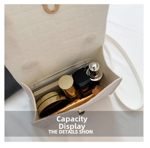 Interior view showing capacity of the white textured flap bag with daily essentials