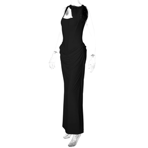 Detail of elegant black sleeveless evening dress showing ruched waist and draped fabric texture