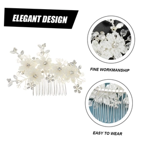 Close-up detail of bridal hair comb with beads, crystal flowers and silver teeth