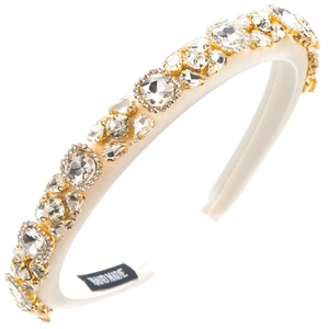 Close-up of luxury white satin headband with crystals and HAND MADE label detail