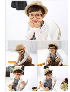 Detailed close-up of kids vintage linen fedora hat with stylish round glasses and cardigan