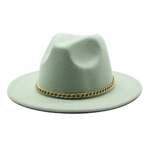 Detailed close-up of mint green wool fedora hat featuring a chunky gold chain decoration