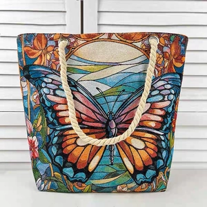 Large butterfly tote bag with rope handles and colorful 3D artistic woven print