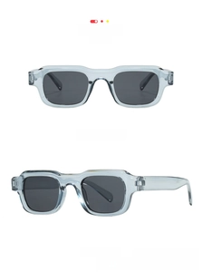 Detail view of neutral square retro sunglasses in grey frame with grey lenses