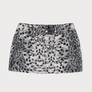 Mini-jupe rétro à imprimé léopard, taille haute avec détails de rivets métalliques
