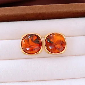 Retro amber resin round earrings with gold plating presented in a premium jewelry box