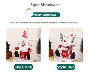 Detail of Christmas Santa and Reindeer dolls with red knit fabric and sequin decor
