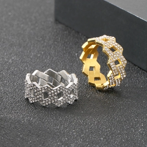 Close-up of hip hop style iced out diamond rings in gold and silver finish