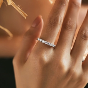 Luxurious D-color moissanite eternity band in S925 sterling silver worn on a finger