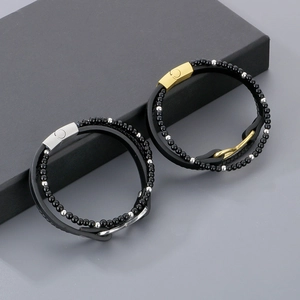 Detail of multilayer woven leather bracelet with beads and magnetic steel clasp