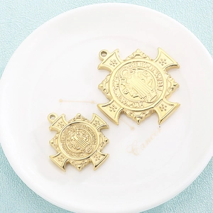 Golden Exorcist medal pendants with intricate religious embossed design in two sizes