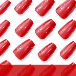 Glossy cherry red medium trapezoid press-on nails displayed on a white background