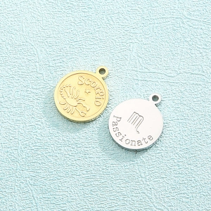Stainless steel zodiac pendants featuring Scorpio and Virgo signs in gold and silver