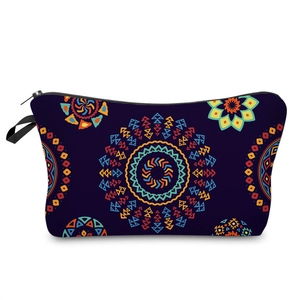 Detail view of ethnic cosmetic bag with geometric circular patterns and black zipper