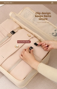 Detail of travel garment bag featuring buckle straps for securing thick clothes and sweaters