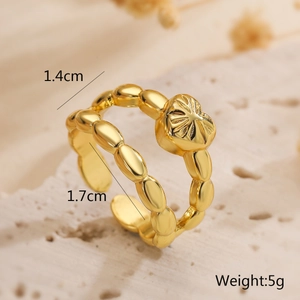 Macro shot of gold plated open ring with heart texture on stone background with size metrics