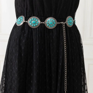 Bohemian silver metal waist chain with round turquoise medallions on black polka dot dress