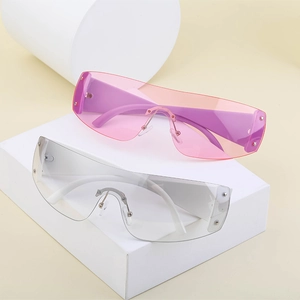 Detail of Y2K rimless sunglasses featuring silver rivets and pink gradient lenses