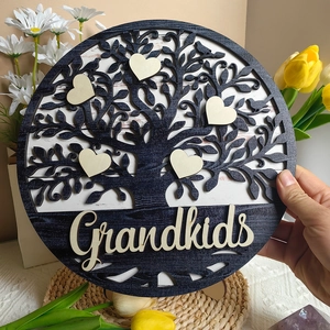 Detail of wooden Tree of Life plaque with heart charms and Grandkids text