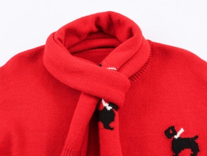 Detail of red knit sweater and scarf set with white and black Scottie dog patterns