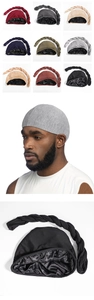 Detail view of nine-color turban hats featuring long braids and smooth satin lining