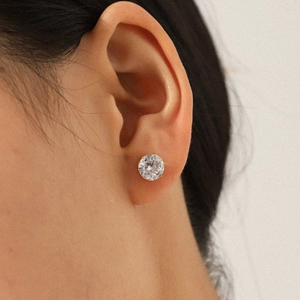 Classic gold stainless steel stud earrings featuring a brilliant round-cut zircon stone