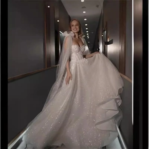 Elegant white sequin ball gown wedding dress with sweetheart neckline and floral embroidery