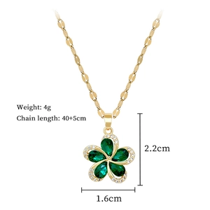 Detail of gold rotating flower necklace with green stones and precise size dimensions